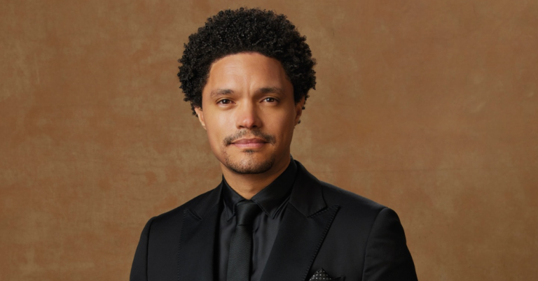 Trevor Noah speaking passionately during a viral discussion about the myth of self-made success and the importance of community support.