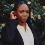 Yinka Ogunbiyi with the HaloBraid robotic braiding system developed to support professional hairstylists.