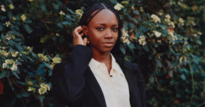Yinka Ogunbiyi with the HaloBraid robotic braiding system developed to support professional hairstylists.